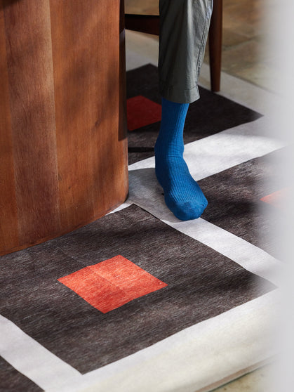 Square orange chenille rug