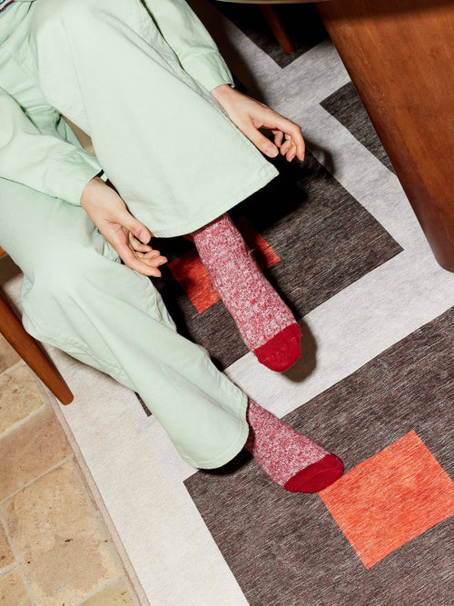 Square orange chenille rug